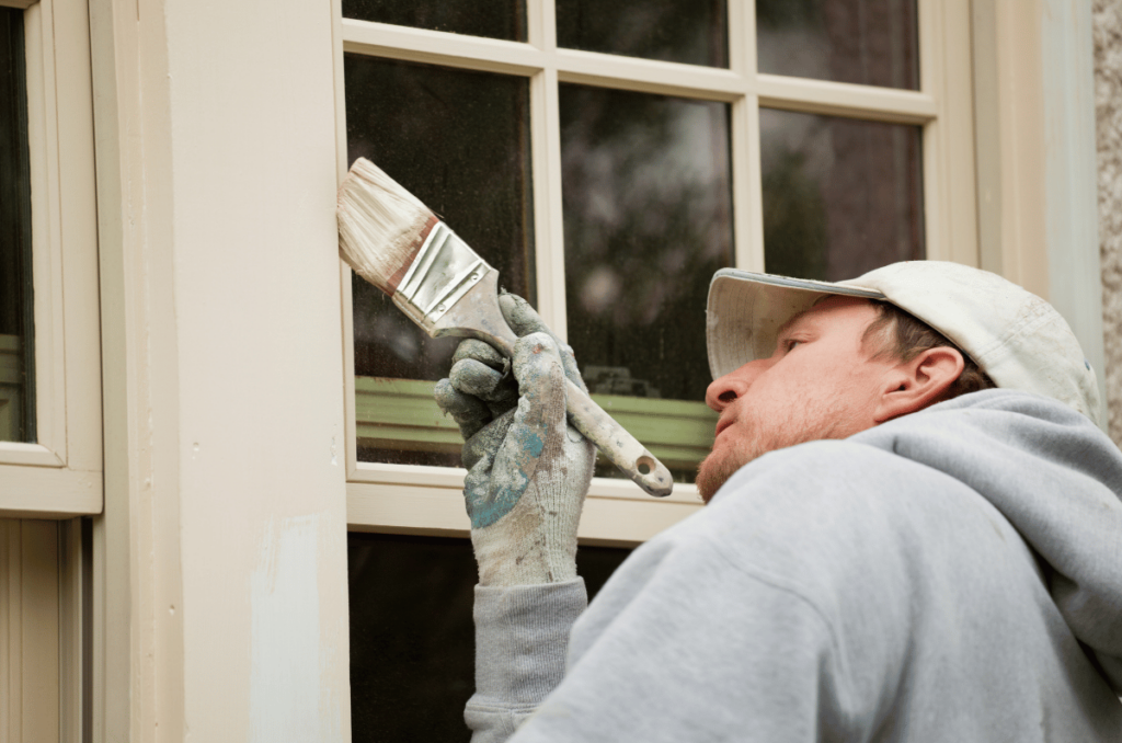 Painting Contractor Denver Paints Window Trim With Brush